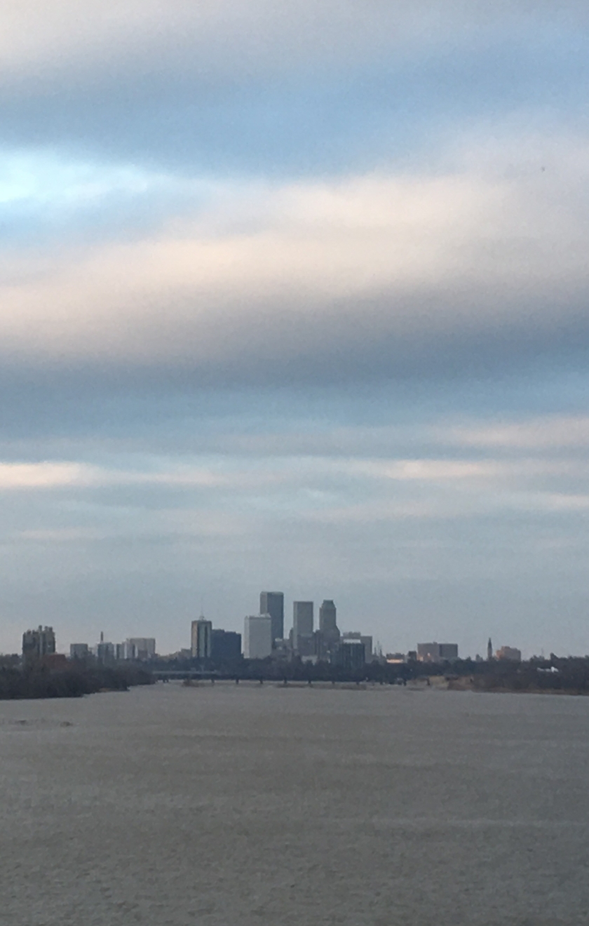 [Tulsa skyline with Arkansas River in front]